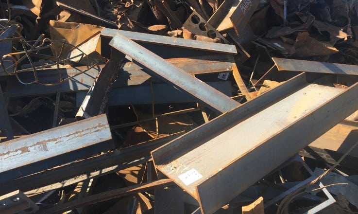 Steel scrap metal pile for recycling and trading.